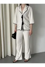 Ensemble chemisier et pantalon naturel à bordures noires