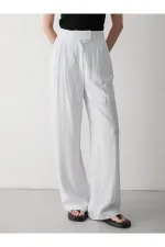 Pantalon blanc à jambes larges avec fermeture velcro