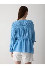 Chemise bleue en mousseline 100% coton avec manches élastiquées