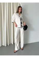 Ensemble chemisier et pantalon naturel à bordures noires