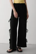 Pantalon noir 100 % coton avec fente latérale et détail de ceinture à nouer