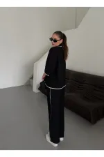 Ensemble chemisier et pantalon noir à bordures naturelles