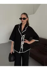 Ensemble chemisier et pantalon noir à bordures naturelles