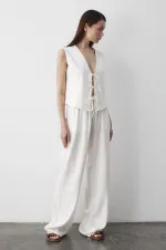 Ensemble gilet en mousseline blanche à 3 lacets