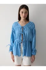 Chemise bleue en mousseline 100% coton avec manches élastiquées