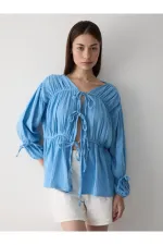Chemise bleue en mousseline 100% coton avec manches élastiquées