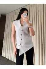 Gilet boutonné à croix vénitienne en pierre