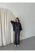 Ensemble anthracite à manches chauve-souris avec détail de bouton lacé