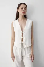 Ensemble gilet en mousseline blanche à 3 lacets