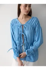 Chemise bleue en mousseline 100% coton avec manches élastiquées