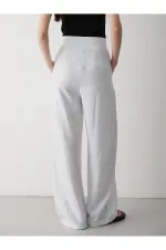 Pantalon blanc à jambes larges avec fermeture velcro