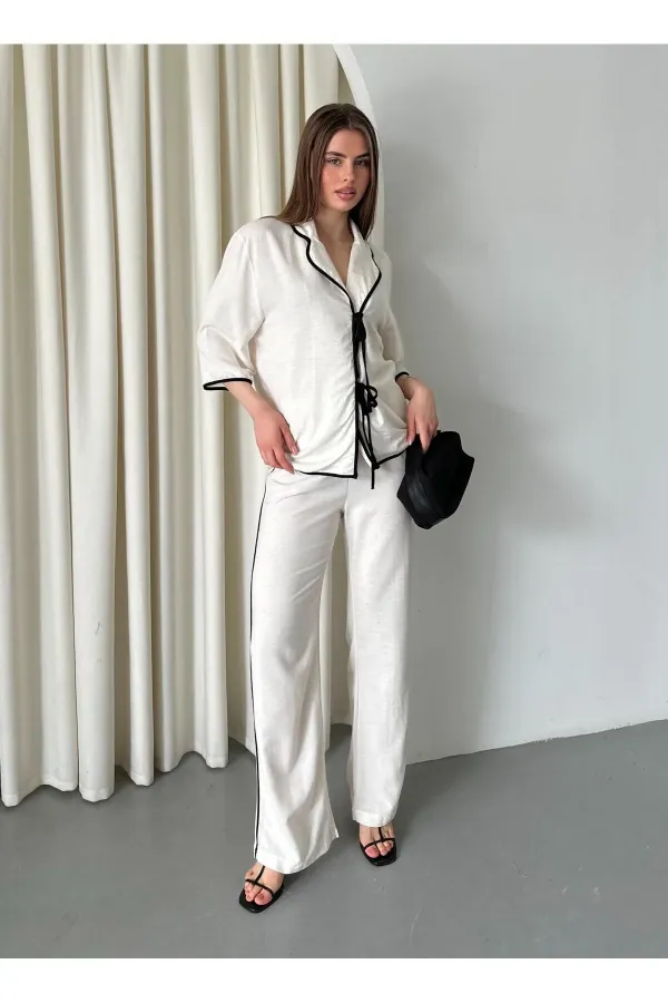 Ensemble chemisier et pantalon naturel à bordures noires