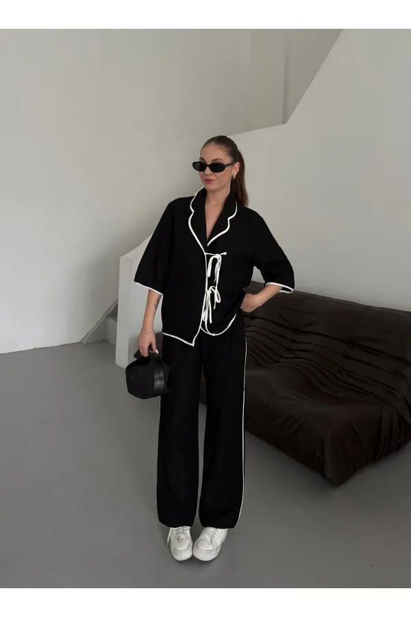 Ensemble chemisier et pantalon noir à bordures naturelles