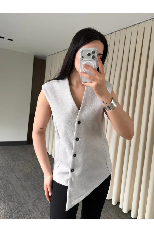 Gilet boutonné à croix vénitienne en pierre