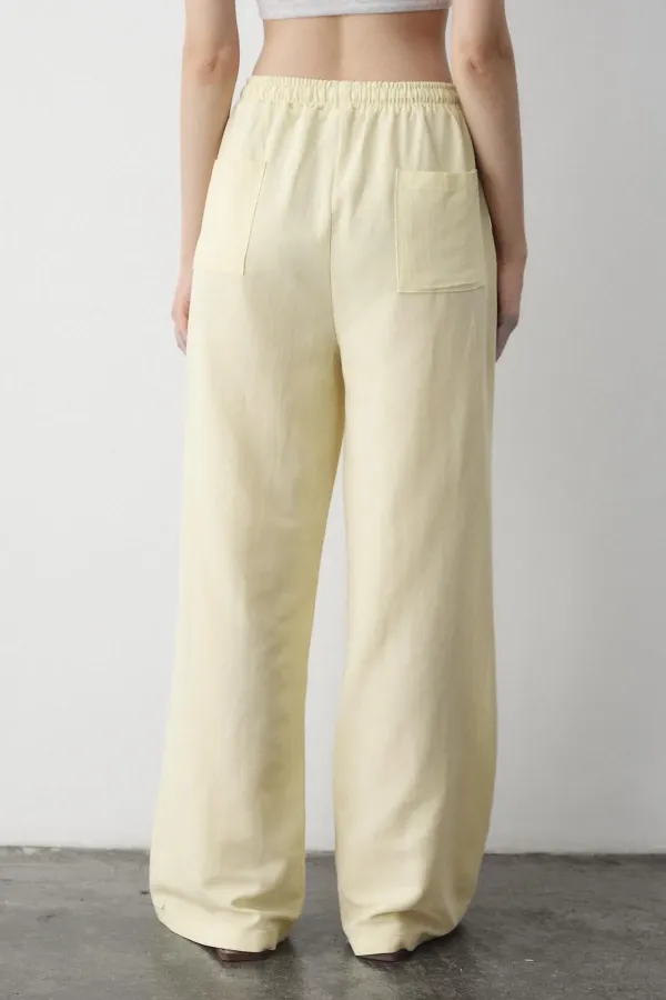 Pantalon jaune en coton et lin avec taille élastiquée