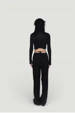 Pantalon en maille stretch noir à taille élastique et jambes larges