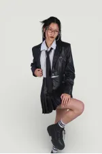 Veste en cuir noire style universitaire