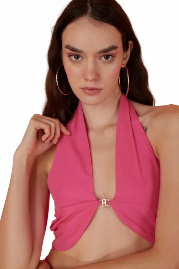 Chemisier rose à accessoires montants