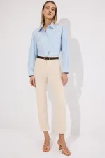 PANTALON EN JEAN À OURLET À FRANGES