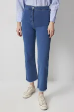 PANTALON EN JEAN À OURLET À FRANGES