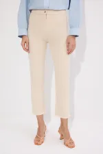 PANTALON EN JEAN À OURLET À FRANGES