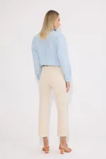 PANTALON EN JEAN À OURLET À FRANGES