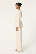 Ensemble tunique et pantalon asymétrique avec détail de ceinture