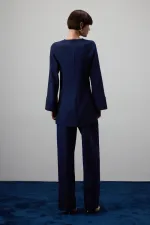 DRAPED BLOUSE WITH METAL ACCESSORIES