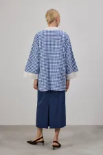 CHEMISE À COL ASYMÉTRIQUE AVEC TWEET