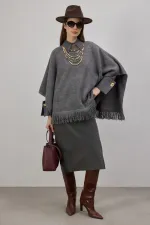 PONCHO EN MAILLE À FRANGES