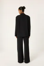 ENSEMBLE VESTE ET PANTALON ASYMÉTRIQUE