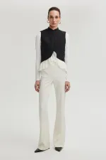 GILET EN CRÊPE À GARNITURE EN MOUSSELINE