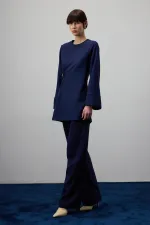 DRAPED BLOUSE WITH METAL ACCESSORIES