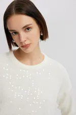 PULL EN MAILLE À PAILLETTES