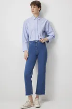 PANTALON EN JEAN À OURLET À FRANGES