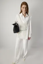 Tunique à col en V et à volants en dentelle