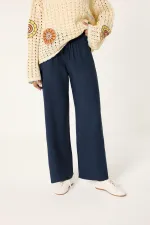 PANTALON LOGAL À JAMBES LARGES