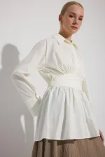 PEPLUM TUNIC WITH CORSET AT THE WAIST