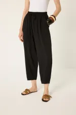 PANTALON CAROTTE AVEC TAILLE ÉLASTIQUE PANTALON CAROTTE AVEC TAILLE ÉLASTIQUE