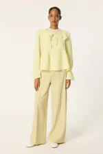 MUSLIN BLOUSE WITH RUFFLED COLLAR MUSLIN BLOUSE WITH RUFFLED COLLAR