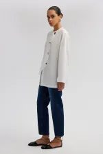 ASYMMETRICAL CUT SHIRT WITH BUTTON DETAIL ASYMMETRICAL CUT SHIRT WITH BUTTON DETAIL