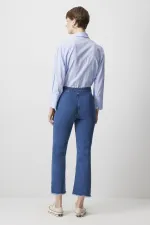 PANTALON EN JEAN À OURLET À FRANGES