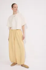 PANTALONS À BONNETS ÉLASTIQUES