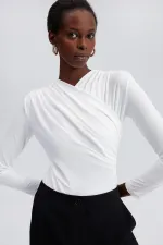 DRAPED SNAP-BUTTON BODYSUIT