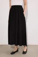 Ensemble veste et jupe drapées en cupra