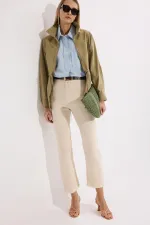 PANTALON EN JEAN À OURLET À FRANGES