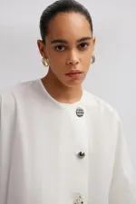 ASYMMETRICAL CUT SHIRT WITH BUTTON DETAIL ASYMMETRICAL CUT SHIRT WITH BUTTON DETAIL