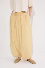 PANTALONS À BONNETS ÉLASTIQUES