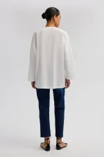 ASYMMETRICAL CUT SHIRT WITH BUTTON DETAIL ASYMMETRICAL CUT SHIRT WITH BUTTON DETAIL