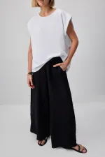 WIDE-LEG MUSLIN PANTS WITH POCKETS